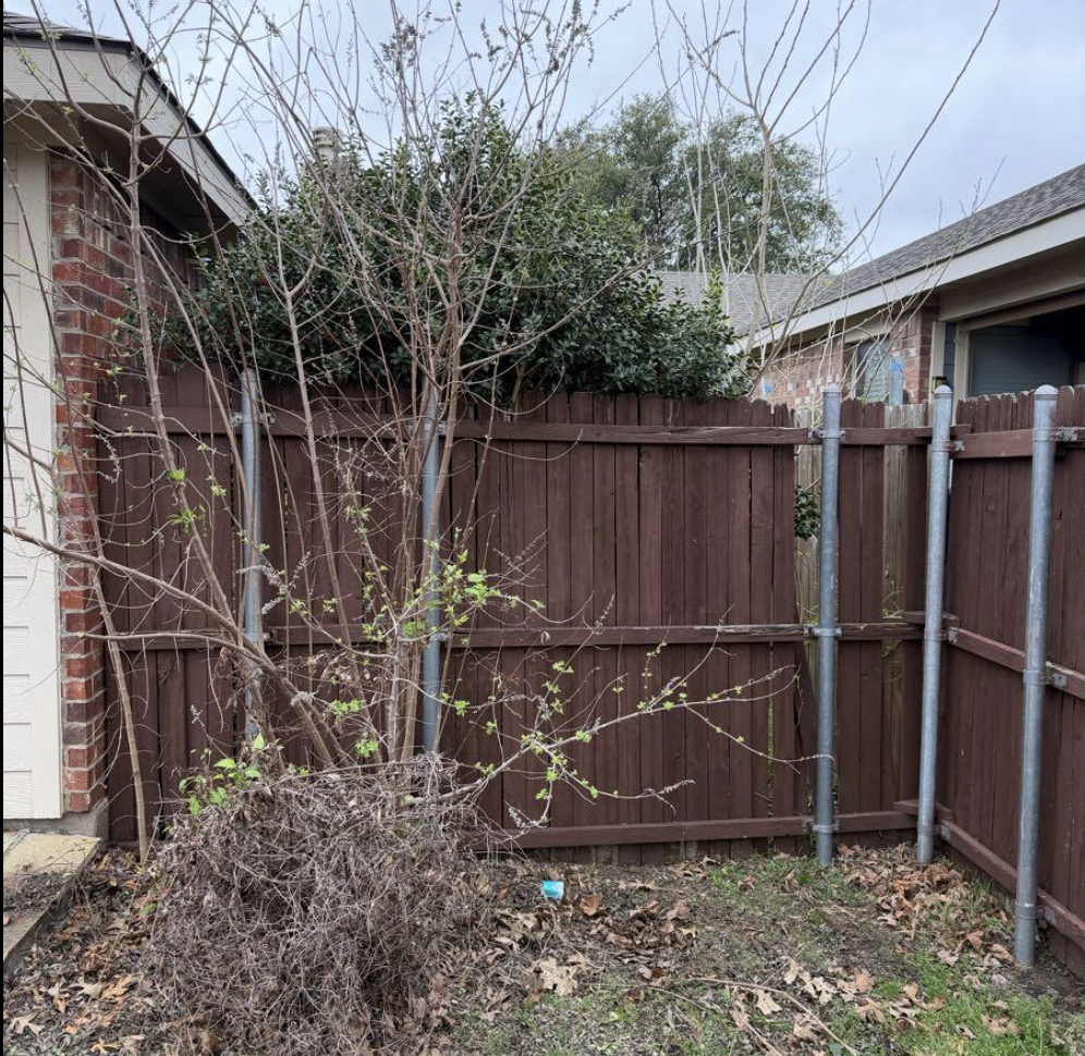 Fence repair and yard cleanup — before
