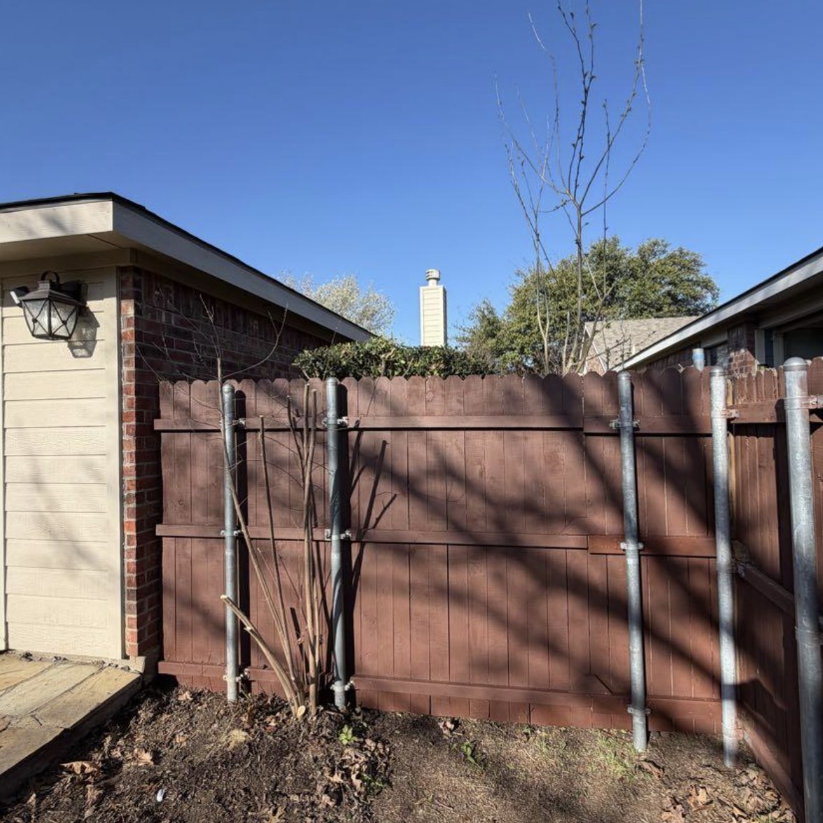 Fence repair and yard cleanup — after